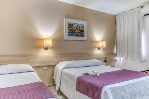 Cama o camas de una habitación en Hotel Praia Bonita Pajuçara