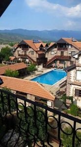 a view of a resort with a swimming pool at Apartments Dan Dar in Nov Dojran