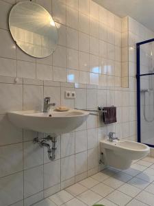 a bathroom with a sink and a toilet at Ferienwohnung Stella in Ichenhausen