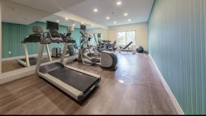 a gym with several treadmills and exercise bikes at Holiday Inn Express & Suites Hood River, an IHG Hotel in Hood River