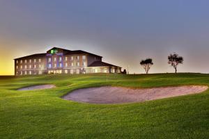 a view of a building on a golf course at Holiday Inn Express & Suites Sioux Center, an IHG Hotel in Sioux Center