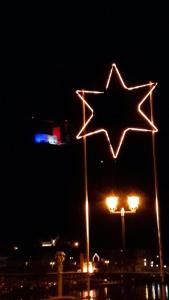 a lit up star on a street light at night at Penthouse Mosel Hunter in Gornhausen