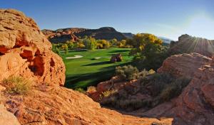 a view of a golf course in the mountains at Holiday Inn Express & Suites St George North - Zion, an IHG Hotel in Washington