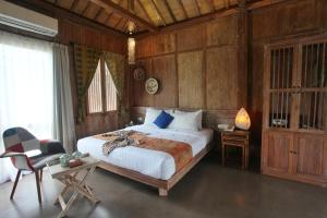 Ένα ή περισσότερα κρεβάτια σε δωμάτιο στο Amata Borobudur Resort
