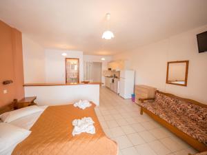 Ένα ή περισσότερα κρεβάτια σε δωμάτιο στο Harbour View - Oceanis Apartments 