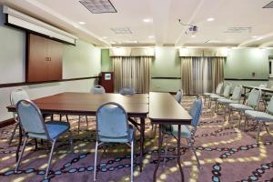 a conference room with a long table and chairs at Holiday Inn Express Hotel & Suites Picayune by IHG in Picayune +33 photos