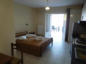 Postel nebo postele na pokoji v ubytování Harbour View - Oceanis Apartments