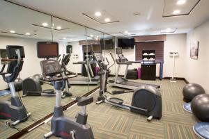 a gym with several treadmills and elliptical machines at Holiday Inn Express & Suites - Oxford, an IHG Hotel in Oxford