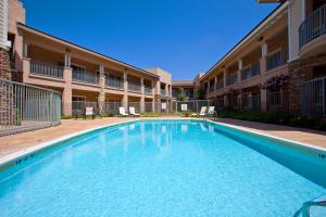 a swimming pool in front of a building at Holiday Inn Express Hotel & Suites San Dimas by IHG in San Dimas