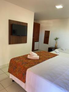 מיטה או מיטות בחדר ב-Hotel Monte Pascoal Smart