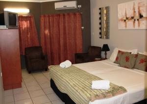 Ein Bett oder Betten in einem Zimmer der Unterkunft Bohemia Resort Cairns