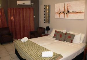 Ein Bett oder Betten in einem Zimmer der Unterkunft Bohemia Resort Cairns