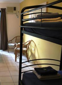 Ein Bett oder Betten in einem Zimmer der Unterkunft Bohemia Resort Cairns