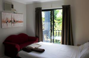 Ein Bett oder Betten in einem Zimmer der Unterkunft Bohemia Resort Cairns