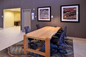 a wooden table topped with a wooden table cloth at Holiday Inn Express Hotels Page, an IHG Hotel in Page