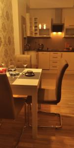 Virtuvė arba virtuvėlė apgyvendinimo įstaigoje Apartament Kosciuszki