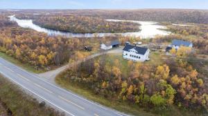 an aerial view of a house next to a road at Goldin in Kautokeino