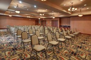 a large room with a bunch of chairs in it at Holiday Inn Express Hotel and Suites Altus by IHG in Altus +46 photos