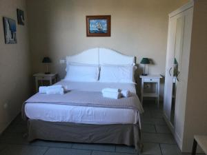 Кровать или кровати в номере Villa Lara