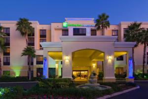 a rendering of a hotel at night with palm trees at Holiday Inn Express Hotel & Suites Kendall East-Miami, an IHG Hotel in Kendall