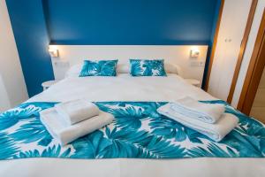 Una cama o camas en una habitación de Apartamentos BCL Playa Albir