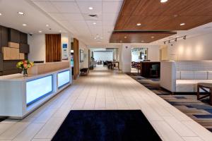 a lobby of a hospital with a waiting area and a reception at Holiday Inn Express & Suites Manhattan, an IHG Hotel in Manhattan