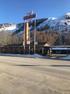 a motel with a sign on the side of a road at Lava Spa Motel & RV in Lava Hot Springs