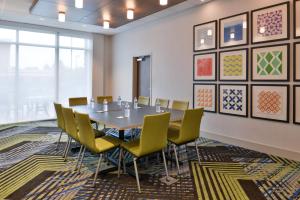 a conference room with a table and chairs at Holiday Inn Express & Suites - Marshalltown by IHG in Marshalltown +40 photos