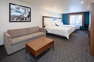 a hotel room with two beds and a couch at Holiday Inn Express Hollywood Walk of Fame by IHG in Los Angeles