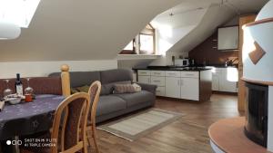 a living room with a couch and a table at Apartment Manuel in Ortisei