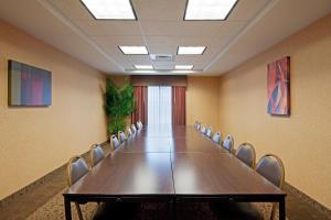 a conference room with a long table and chairs at Holiday Inn Express & Suites Malone, an IHG Hotel in Malone