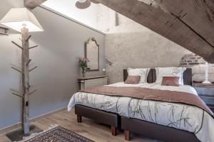 Voodi või voodid majutusasutuse Auberge l'Entrecôte toas