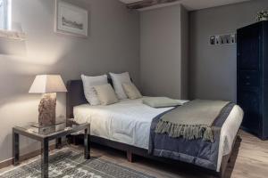 Voodi või voodid majutusasutuse Auberge l'Entrecôte toas