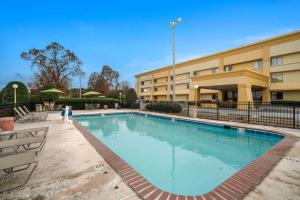 a large swimming pool in front of a building at La Quinta by Wyndham Jackson in Jackson