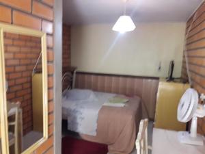 Cama o camas de una habitación en Hotel Pousada Casa Nostra