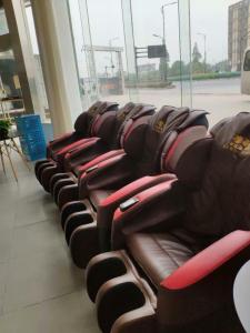 a row of leather seats in a building at 7 Days Inn (Hangzhou Xiaoshan Airport West Gate) in Hangzhou