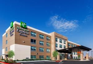 an office building with a hospital express and services sign on it at Holiday Inn Express and Suites Chanute, an IHG Hotel in Chanute