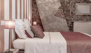 Voodi või voodid majutusasutuse Auberge l'Entrecôte toas