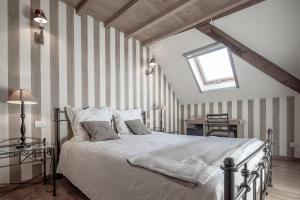 Voodi või voodid majutusasutuse Auberge l'Entrecôte toas