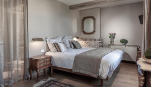 Voodi või voodid majutusasutuse Auberge l'Entrecôte toas