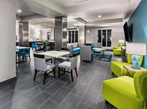 a dining room with a table and chairs at Holiday Inn Express and Suites Killeen-Fort Hood Area, an IHG Hotel in Killeen