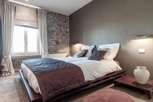 Voodi või voodid majutusasutuse Auberge l'Entrecôte toas