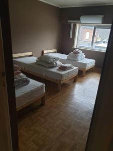 Un pat sau paturi într-o cameră la Residentie 't Leugentje