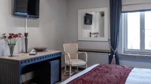Voodi või voodid majutusasutuse Auberge l'Entrecôte toas