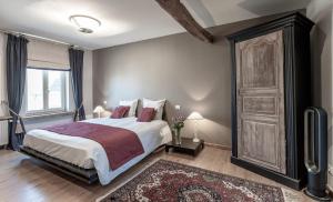 Voodi või voodid majutusasutuse Auberge l'Entrecôte toas
