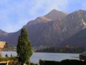 a view of a lake with mountains in the background at Haus St_ Michael_ Ferienwohnung 1_4 in Schliersee