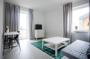 Televízia a/alebo spoločenská miestnosť v ubytovaní Apartament Nadbystrzycka no.14