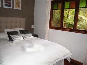 Un pat sau paturi într-o cameră la Mount Browne Cottage