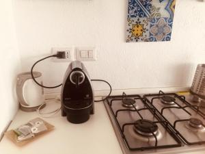 Kuchyň nebo kuchyňský kout v ubytování Delizioso appartamento in corte