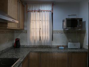 Kuchnia lub aneks kuchenny w obiekcie Apartamento primera linea Isla Canela